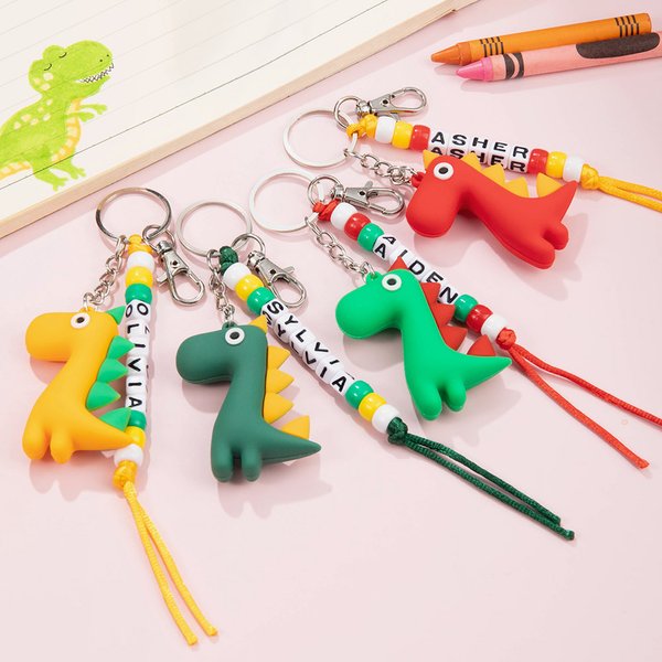 Personalisierte niedliche bunte Cartoon Dinosaurier Beaded Keychain mit Namen Rucksack Zubehör Geburtstag zurück zu Schule für Jungen Mädchen