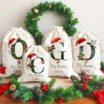 Bolsa de regalo personalizada de lona con cordón campana muérdago gorro de Papá Noel inicial nombre y texto regalo de Navidad para familia y niños