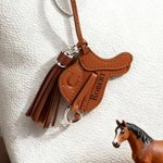 Personalized Saddle Design PU Leather Bag Charm Ornament with Name and Tassel Horseback Riding Birthday Gift for Horse Riders Lovers