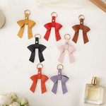 Personalisierte Multicolor PU Leder Bogen Tasche Charme Schlüsselanhänger mit anfänglichen Geburtstag Weihnachten Geschenk für Frau Mädchen