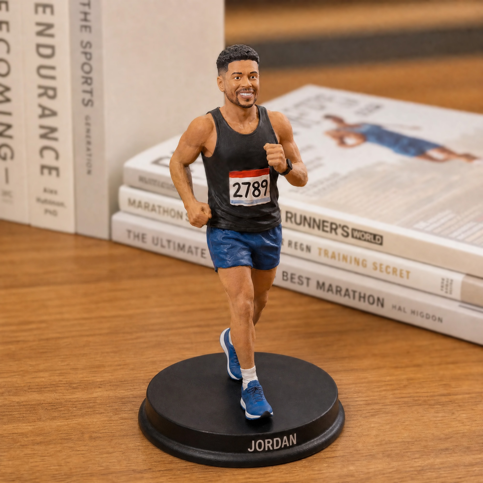 Runner figurine displayed on desk with books