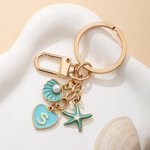 Gepersonaliseerde sleutelhanger in oceaanstijl met schelp en zeester, met initiaal als tasbedeltje – decoratie voor dagelijks gebruik, verjaardagscadeau voor vrienden en liefhebbers van de zee