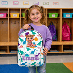 Sac à dos personnalisé avec personnage de dessin animé : licorne fantastique et dinosaure, avec prénom. Pour un usage quotidien, la rentrée scolaire ou comme cadeau d'anniversaire pour filles, garçons