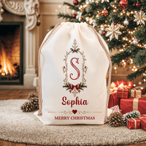 Borsa regalo con cordoncino in tela personalizzata con cornice vintage, motivo a fiocco di agrifoglio e iniziale, con nome – Regalo per la festa della vigilia di Natale per bambini e famiglia