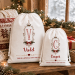 Borsa regalo con cordoncino in tela personalizzata con cornice vintage, motivo a fiocco di agrifoglio e iniziale, con nome – Regalo per la festa della vigilia di Natale per bambini e famiglia