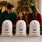 Borsa regalo con cordoncino in tela personalizzata con cornice vintage, motivo a fiocco di agrifoglio e iniziale, con nome – Regalo per la festa della vigilia di Natale per bambini e famiglia