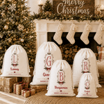 Borsa regalo con cordoncino in tela personalizzata con cornice vintage, motivo a fiocco di agrifoglio e iniziale, con nome – Regalo per la festa della vigilia di Natale per bambini e famiglia