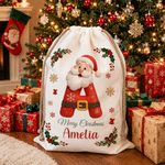 Borsa regalo personalizzata in tela con Babbo Natale e il messaggio “Buon Natale”, con nome e iniziale: regalo della vigilia di Natale per i bambini