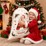 Borsa regalo personalizzata in tela con Babbo Natale e il messaggio “Buon Natale”, con nome e iniziale: regalo della vigilia di Natale per i bambini