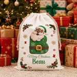 Borsa regalo personalizzata in tela con Babbo Natale e il messaggio “Buon Natale”, con nome e iniziale: regalo della vigilia di Natale per i bambini